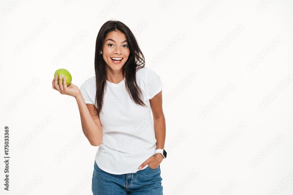 Portrait of a happy healthy woman holding green apple Portrait of a happy healthy woman holding green apple