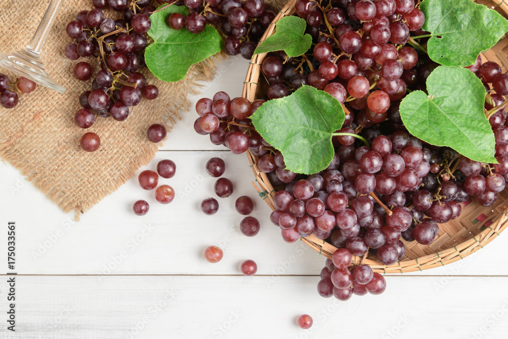 Fresh champagne Grapes on bamboo basket Fresh champagne Grapes on bamboo basket