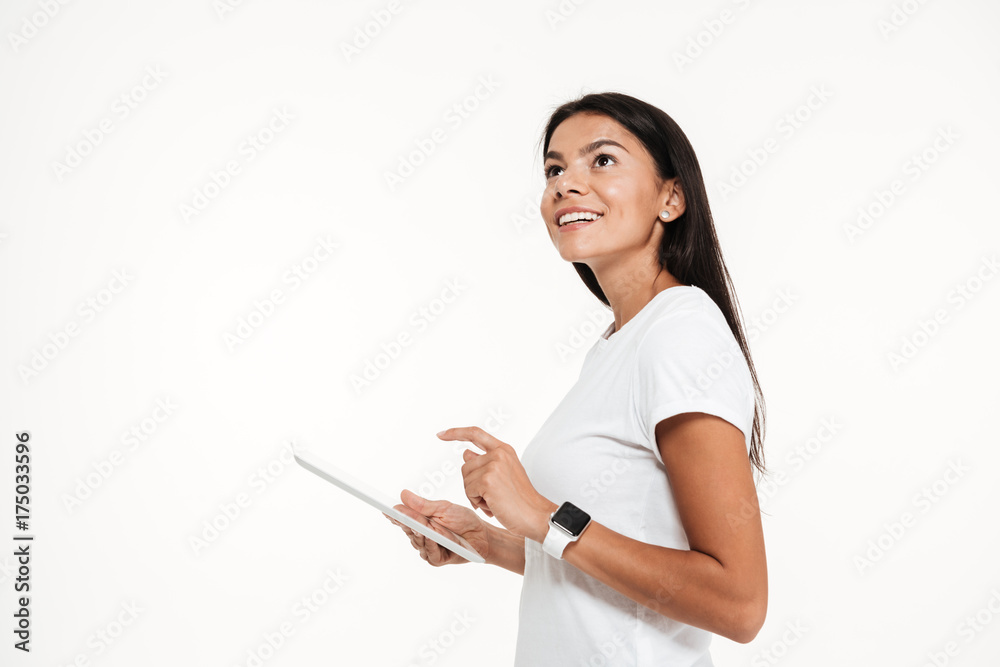 Portrait of a young happy woman holding tablet computer Portrait of a young happy woman holding tablet computer