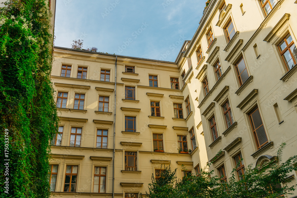 beautiful yellow backyard of apartment houses with yellow facade beautiful yellow backyard of apartment houses with yellow facade