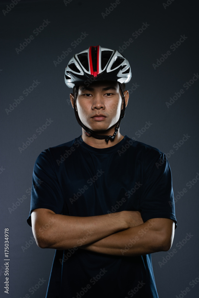 Portrait of an asian man cyclist with helmet and sportswear. Portrait of an asian man cyclist with helmet and sportswear.