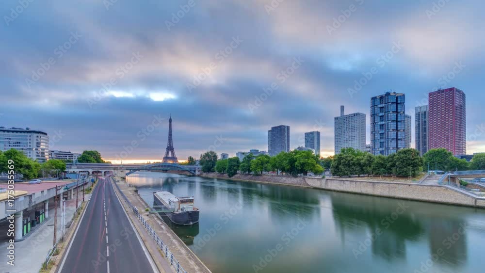 Eiffel Tower sunrise timelapse with boats on Seine river and in Paris, France. Eiffel Tower sunrise timelapse with boats on Seine river and in Paris, France.