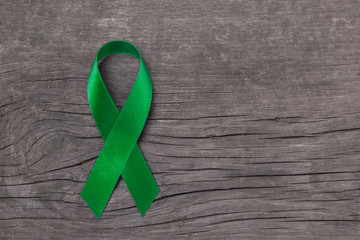 Lime Green ribbon for Lymphoma Cancer and mental health awareness raising support and help patient living with illness