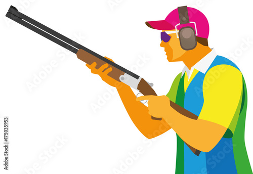 A young man is sportsman a shooter by clay pigeon, which is preparing a shot