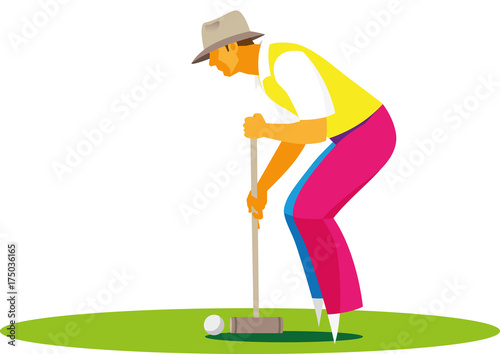 young man in a hat playing croquet on the field