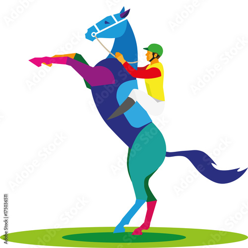 A young jockey sits on a horse that stands on its hind legs