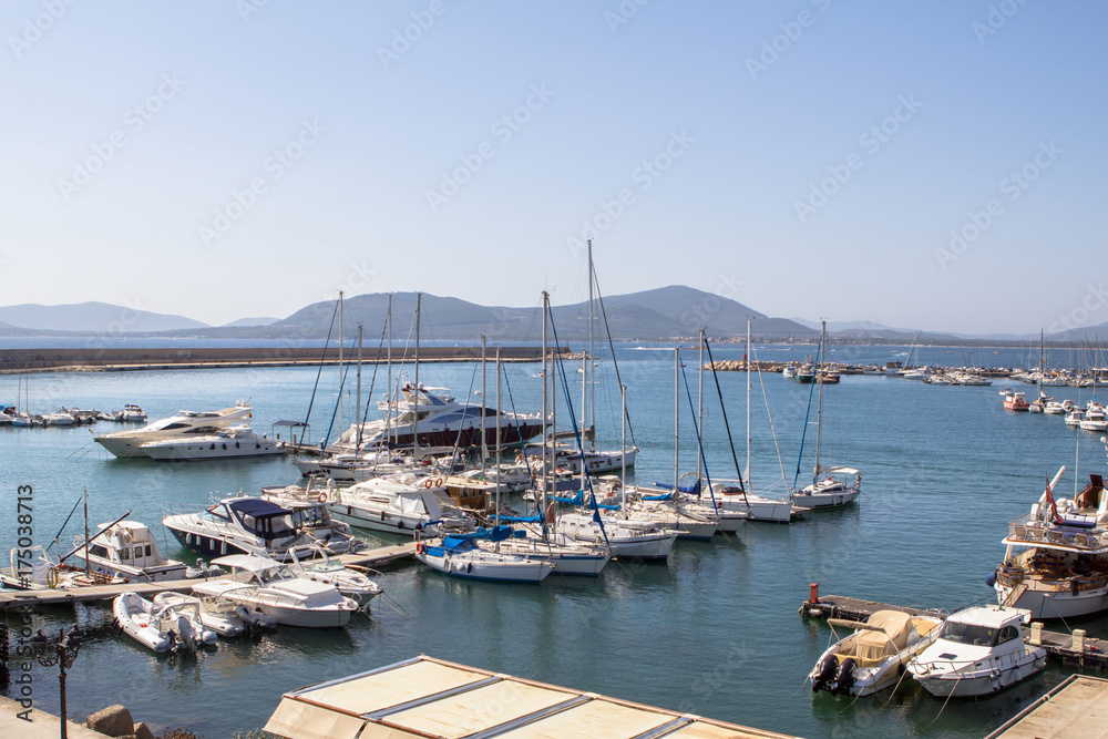 Yachts anchored in the port of Alghero, Sardinia..