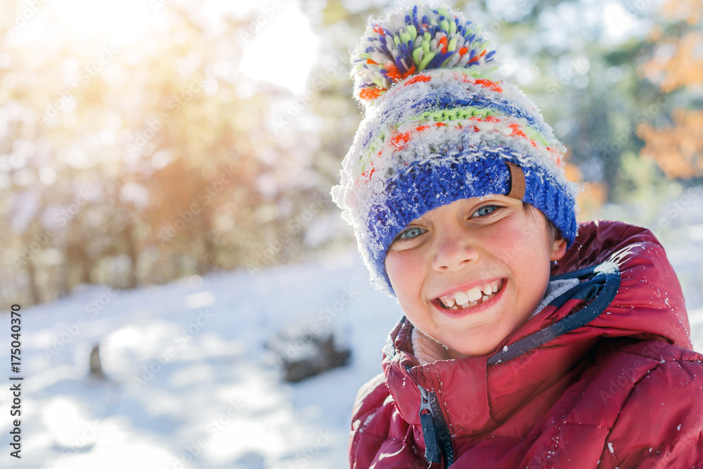 Boy playing in big snow in winter. Boy playing in big snow in winter.