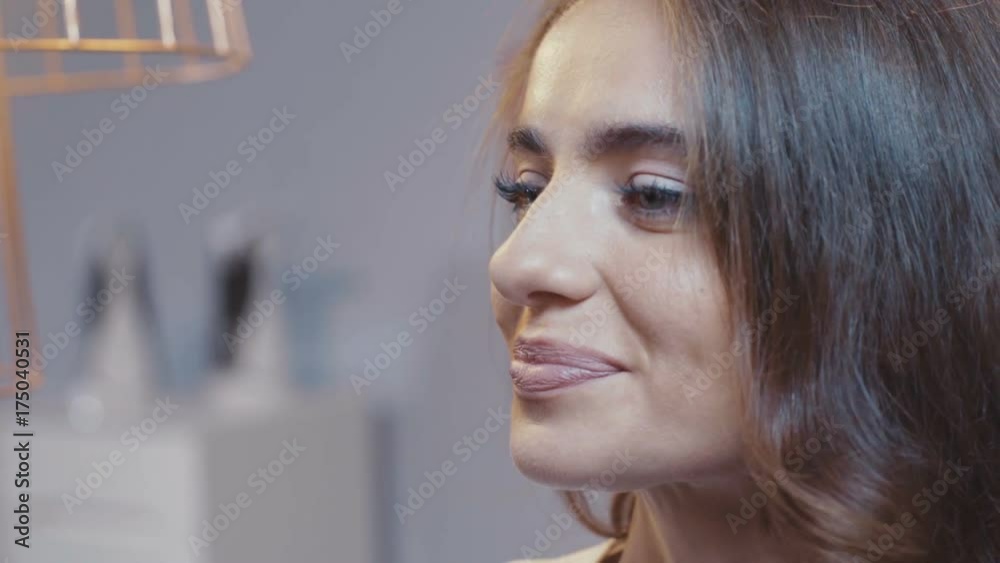 Beautiful young woman takes glasses to smile and looks away. Business woman. In the office. Close-up. Shot on RED Epic Camera. Beautiful young woman takes glasses to smile and looks away. Business woman. In the office. Close-up. Shot on RED Epic Camera.