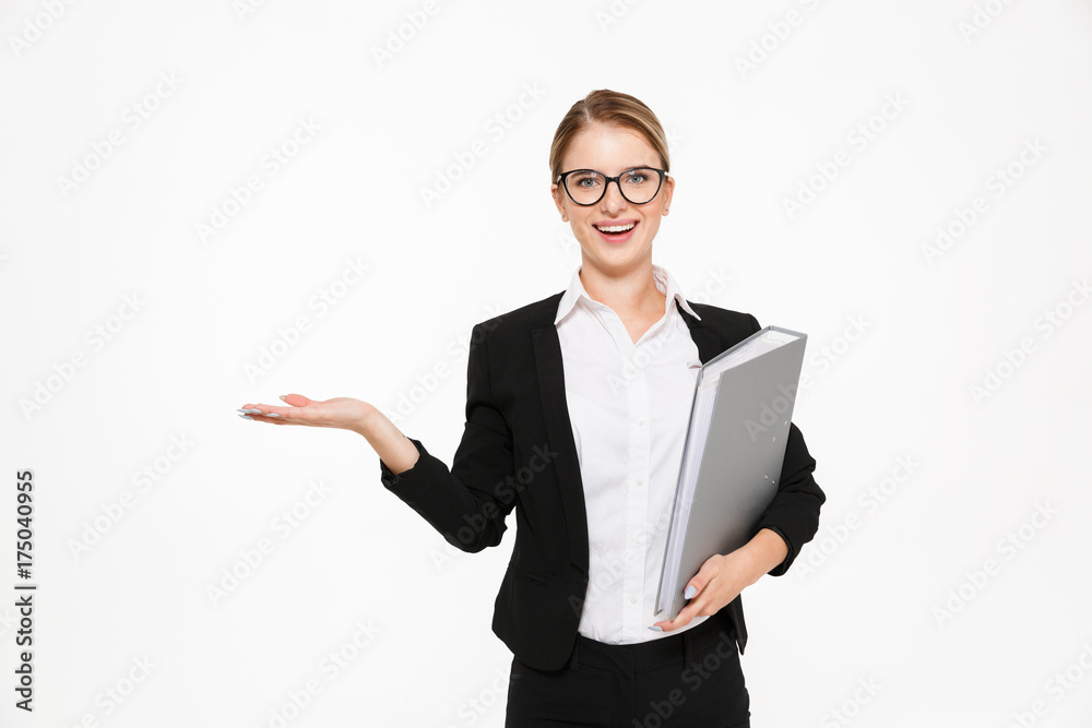 Happy blonde business woman in eyeglasses with folder in hand Happy blonde business woman in eyeglasses with folder in hand