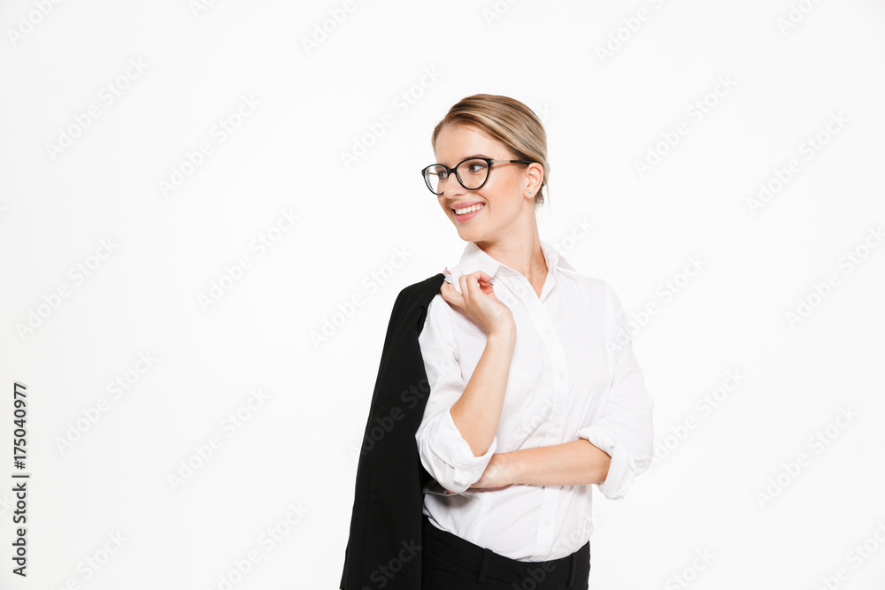 Smiling blonde business woman in eyeglasses holding her jacket Smiling blonde business woman in eyeglasses holding her jacket