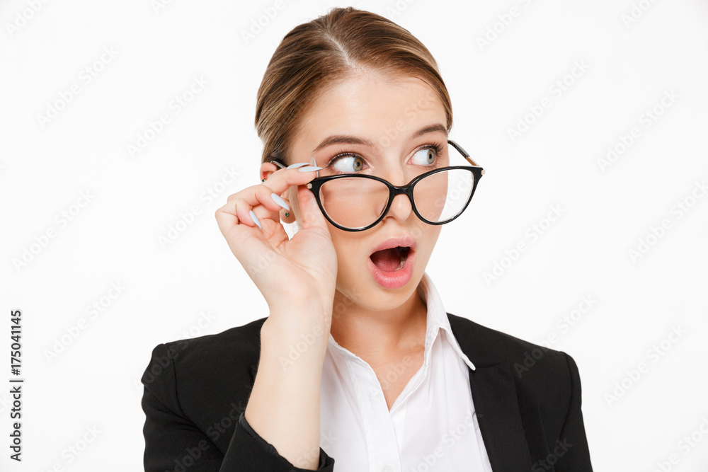 Close up picture of shocked blonde business woman in eyeglasses Close up picture of shocked blonde business woman in eyeglasses