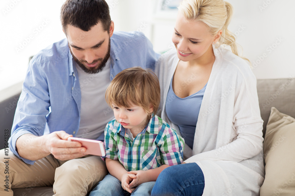 happy family with smartphone at home