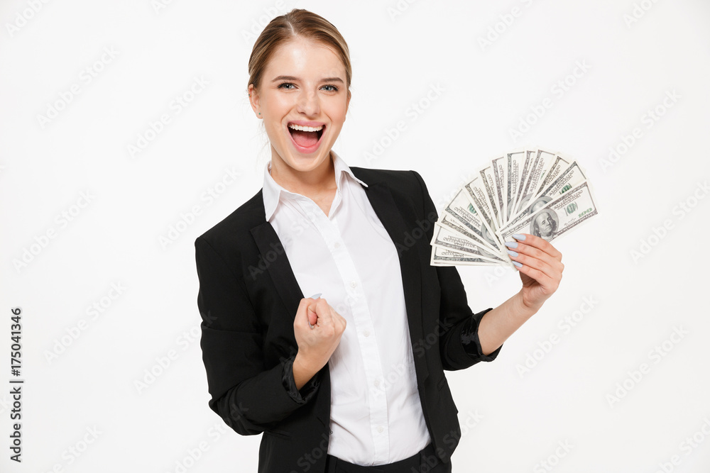 Happy screaming blonde business woman holding money Happy screaming blonde business woman holding money