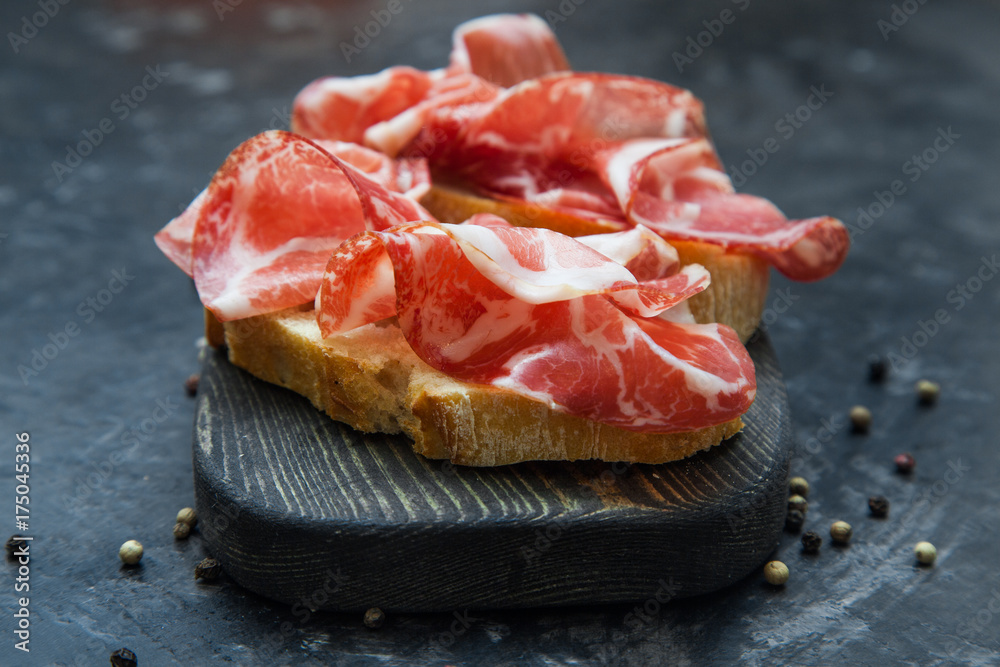 A sandwich with Parma ham. Ciabatta.