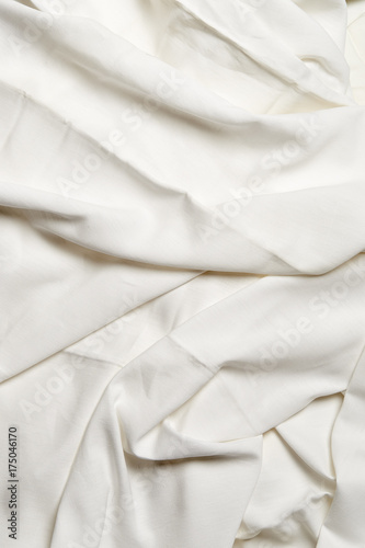Textured white crumpled sheets