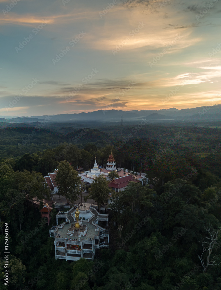 Φωτογραφία Aerial low light,sunset shot of Nan landmark, Wat Phra That Khao Noi, Old temple