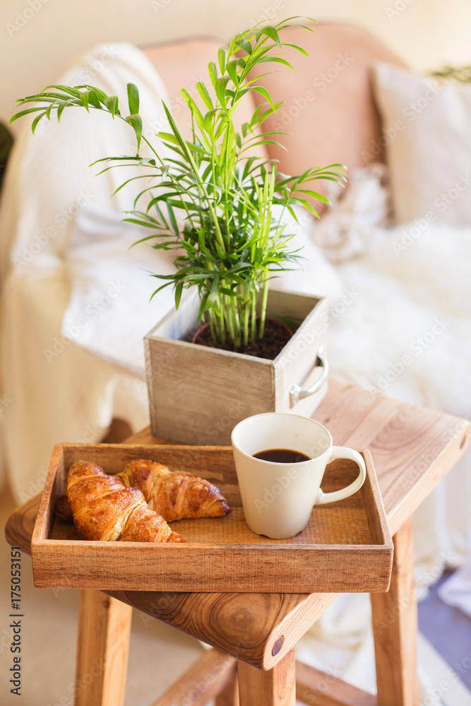 Morning cup coffee or tea with croissant apartment interiour