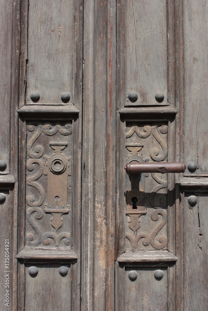 Rustic door handle on old wooden door