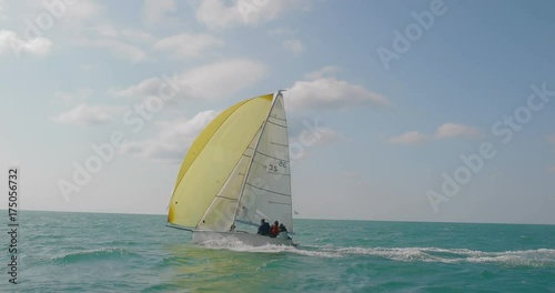 Cruise yacht race. Sailboat pulls forward