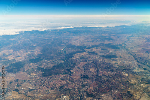Airplane View Of City And Earth Horizon