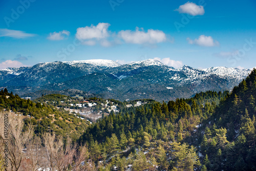 A wide-angle sunny,autumn midday view of snow coated Helmos mountain which located in Peloponnese. Grecce photo