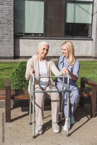 nurse and senior patient with walker