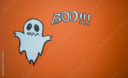 Scary white ghost design on black background with boo letters. Halloween celebration. Cartoon ghost wreath. Spooky and scary holiday monster design. Silhouette ghost creepy, funny and cute.