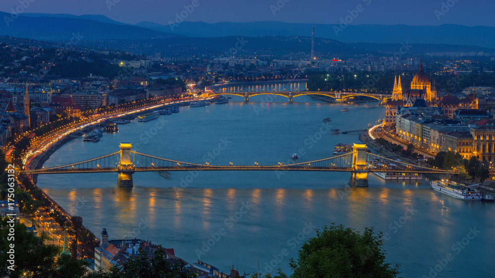 Budapest, Hungary - Panoramic skyline view at blue hour of the famous Szechenyi Chain Bridge, Margaret Bridge, Margaret Island and Parliament of Hungary with Buda Hills at background with colorful sky