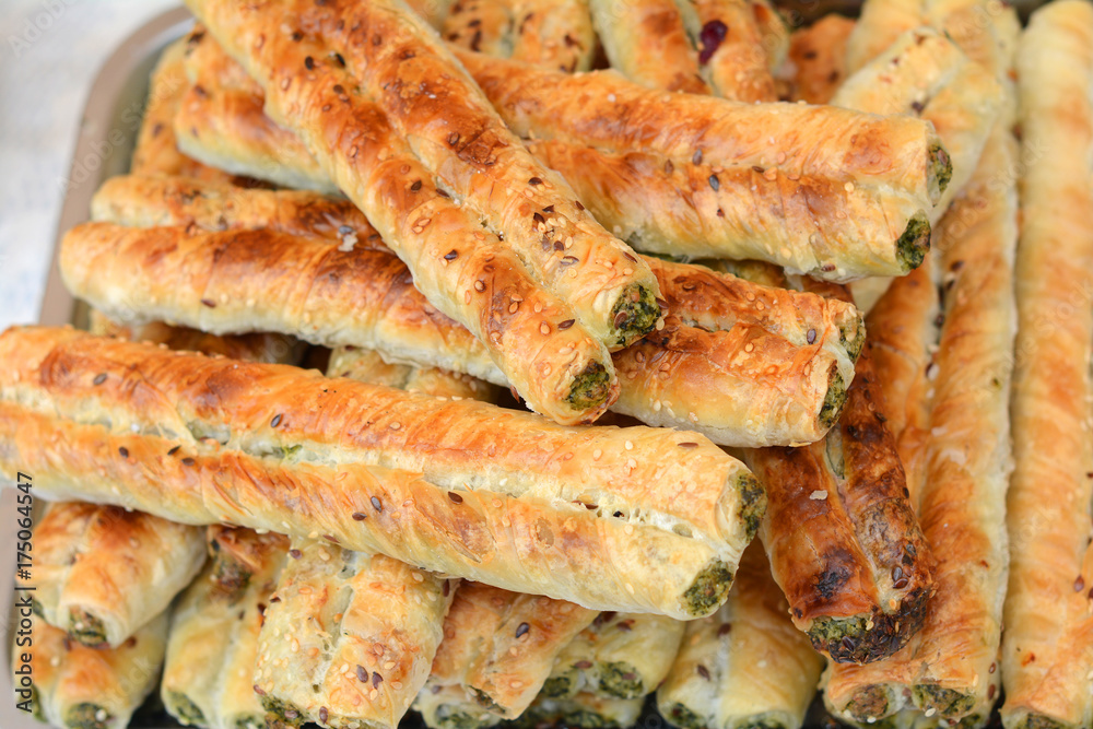 Puff pastry with filling. Rollini with brynza cheese and spinach Puff pastry with filling. Rollini with brynza cheese and spinach