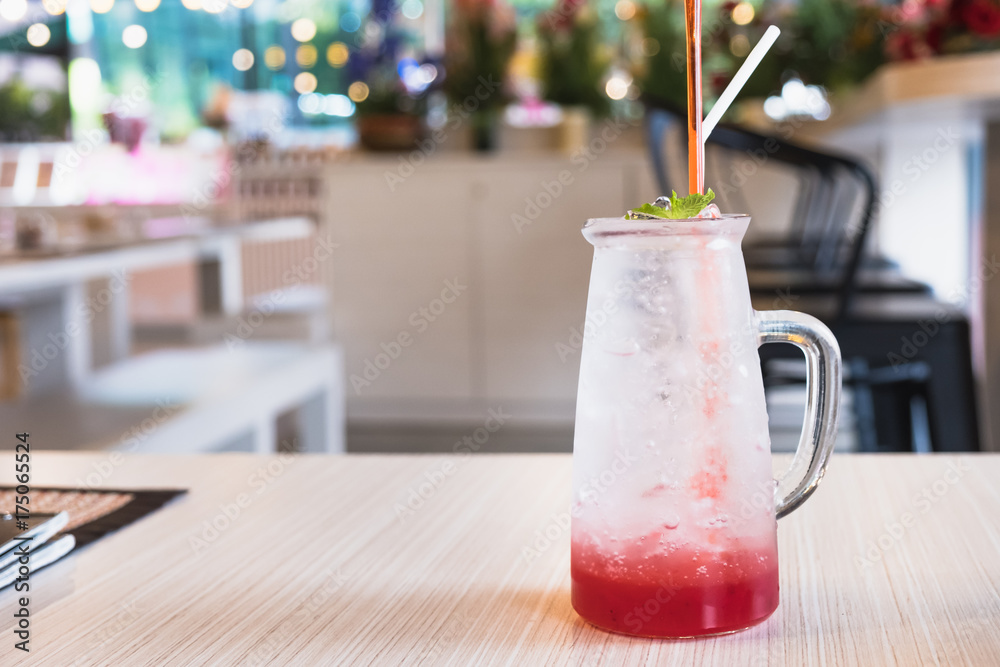 Italian strawberry soda on wood table.