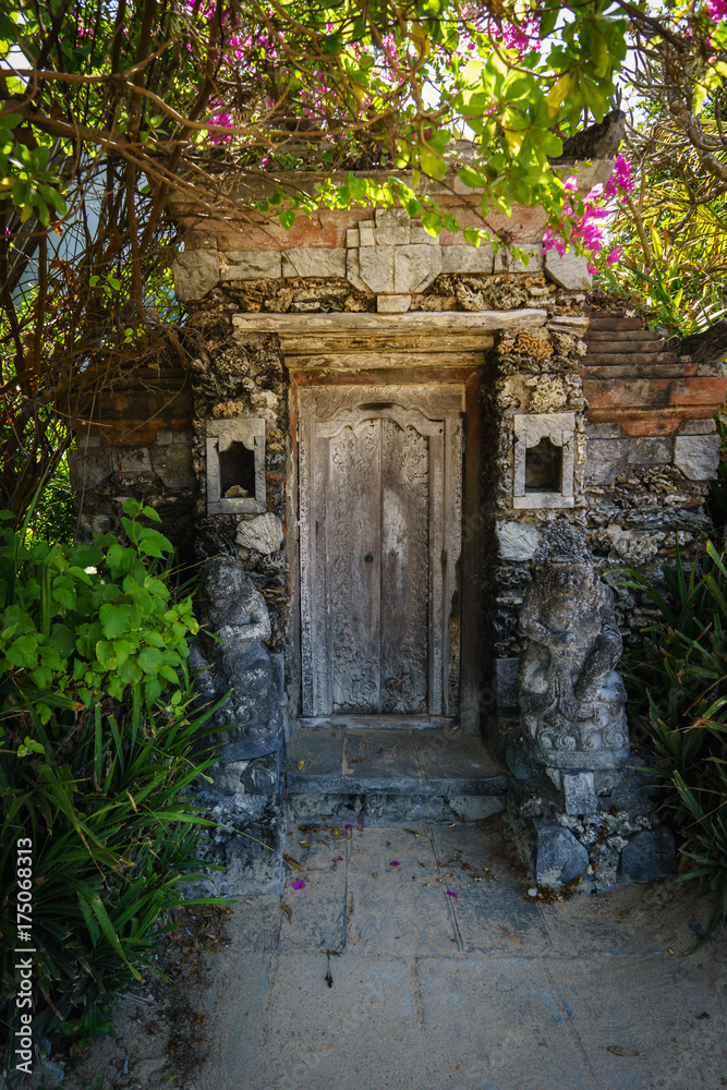 Old wooden door near beach Sanur Bali
