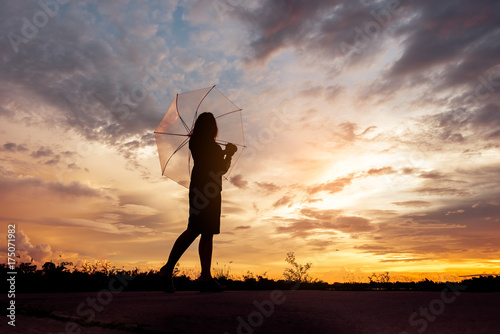 freedom women and umbrellas on sunset