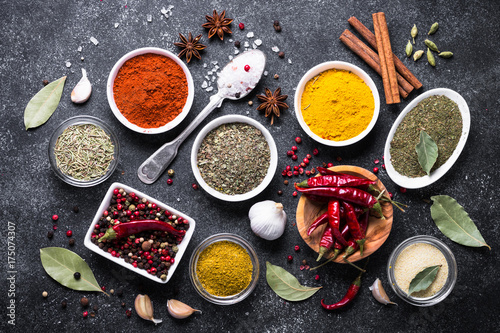 Set of Various spices on black stone table. 