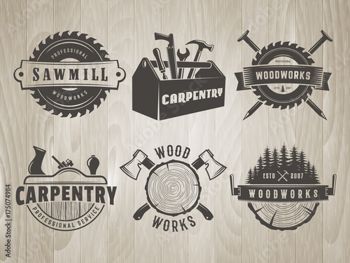 Woodwork logos. Vector badges for carpentry, sawmill, lumberjack service or woodwork shop. Set of hand tools labels on vintage wooden background.