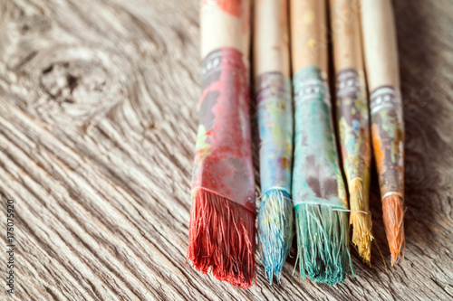 Close-up view of dirty paint brushes