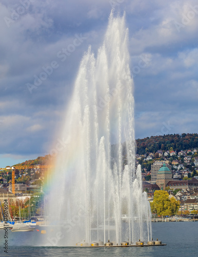 Fountain on Lake Zurich in the cloudy evening in autumn