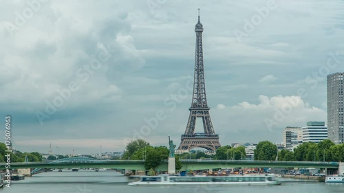 The Statue of Liberty and the Eiffel Tower Timelapse. Paris, France photo