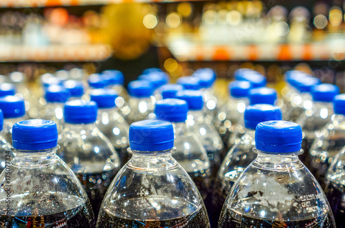 Many bottles with pepsi top view. background made by big pepsi bottles