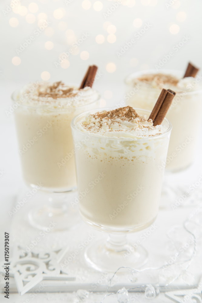 traditional Christmas eggnog with whipped cream and cinnamon traditional Christmas eggnog with whipped cream and cinnamon