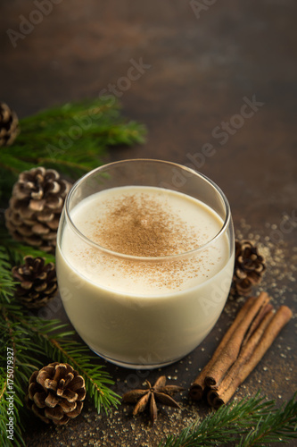 Traditional Christmas drink eggnog with grated nutmeg  and cinnamon