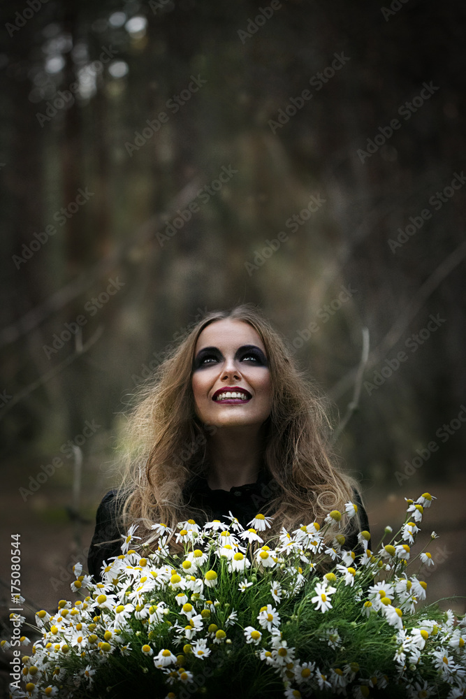 Halloween. beautiful girl witches in the woods with pumpkins Halloween. beautiful girl witches in the woods with pumpkins