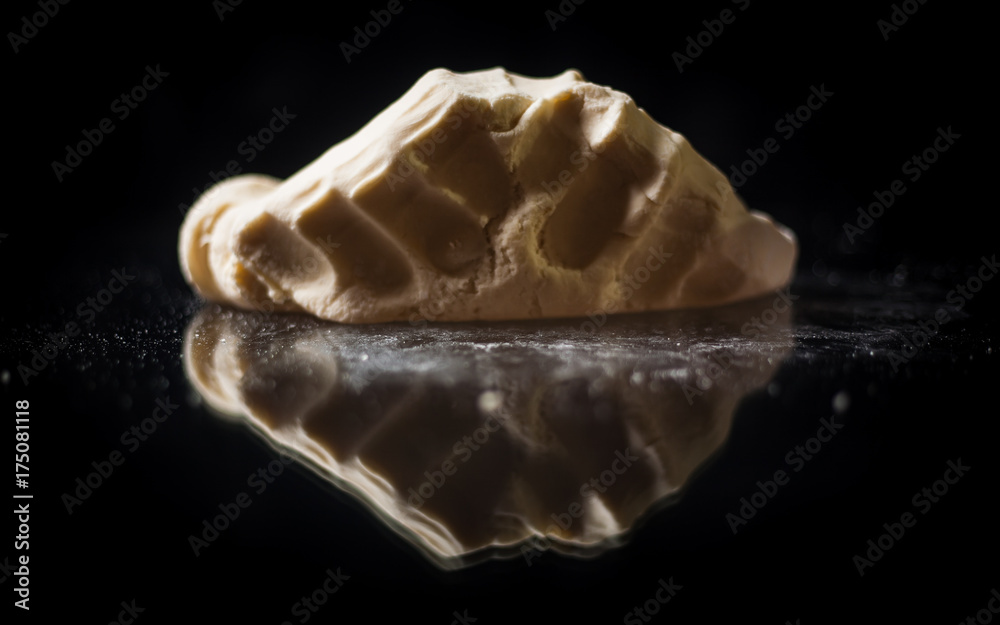 The man cook prepares flour products and meal-free flour on a glass table. Beautiful conceptual photo The man cook prepares flour products and meal-free flour on a glass table. Beautiful conceptual photo