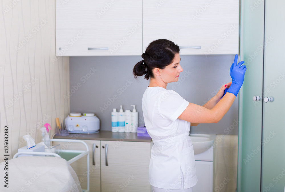 Cosmetologist preparing for work Cosmetologist preparing for work