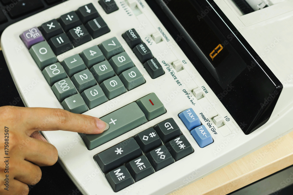 Closeup of Accountant Hands Counting on Calculator Closeup of Accountant Hands Counting on Calculator