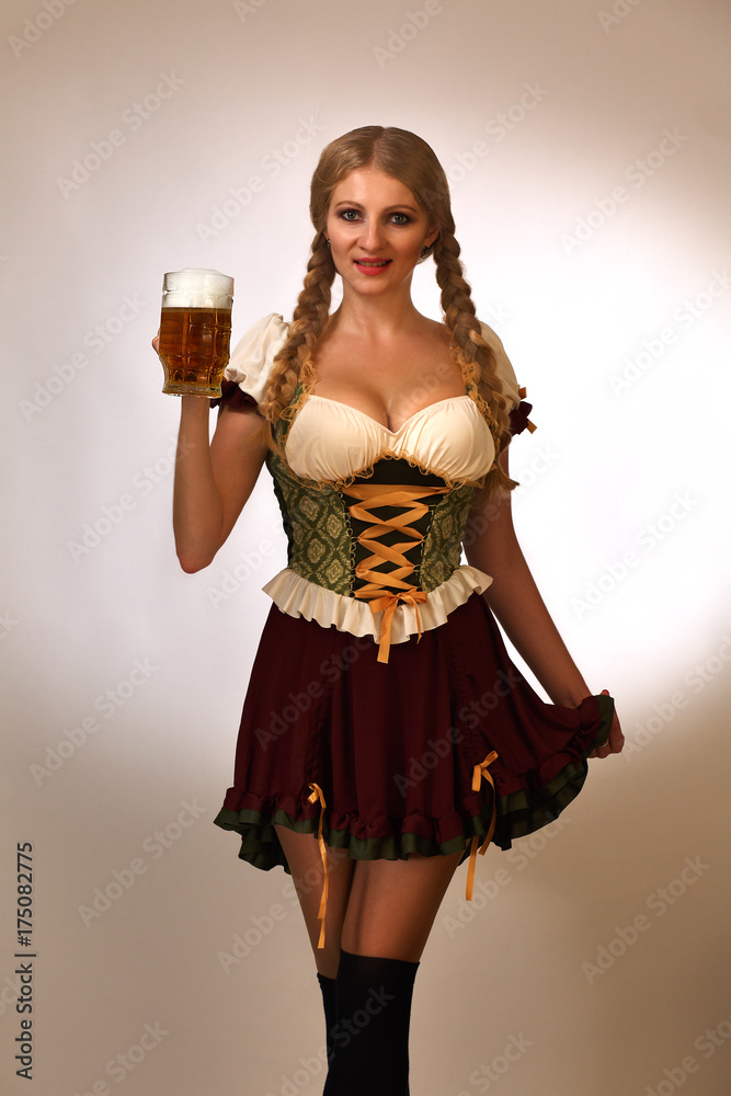 the blond young with one hand lifting her skirt, the other holding a mug of light beer, wearing a Czech national costume with a haircut pigtail, standing on a white background smiling the blond young with one hand lifting her skirt, the other holding a mug of light beer, wearing a Czech national costume with a haircut pigtail, standing on a white background smiling