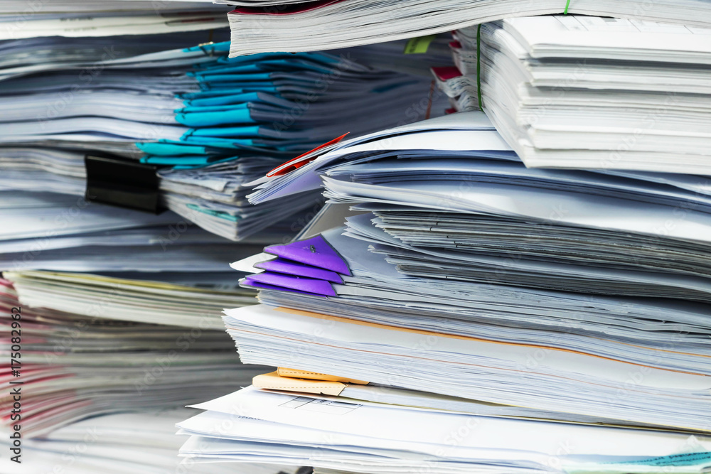 Paper documents stacked in archive Paper documents stacked in archive