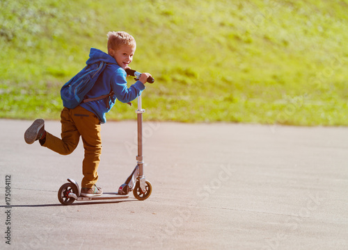 cute little boy riding scooter, active sport kids