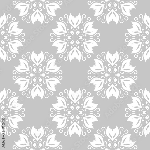 Gray and white floral ornament. Seamless pattern for textile and wallpapers