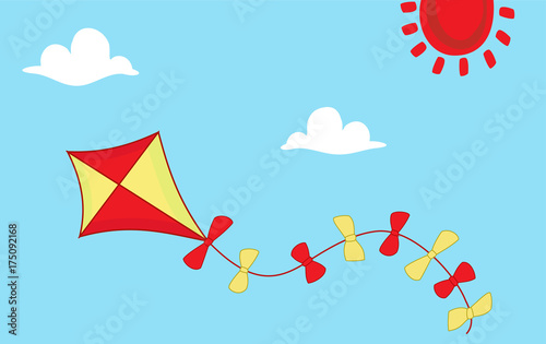 Colored kite flies on background of blue sky. 